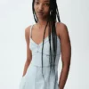 Abito lungo a corsetto con cuciture in denim