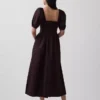 Abito lungo a corsetto con maniche a sbuffo