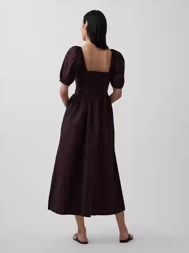 Abito lungo a corsetto con maniche a sbuffo