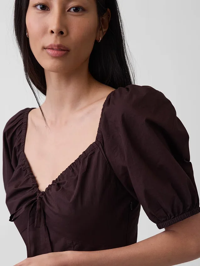 Abito lungo a corsetto con maniche a sbuffo