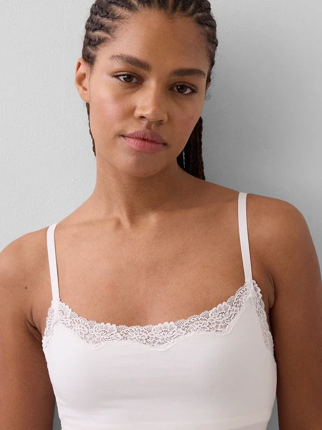 Canotta con reggiseno incorporato in cotone elasticizzato biologico con bordi in pizzo