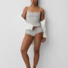 Canotta con reggiseno incorporato in cotone elasticizzato biologico con bordi in pizzo