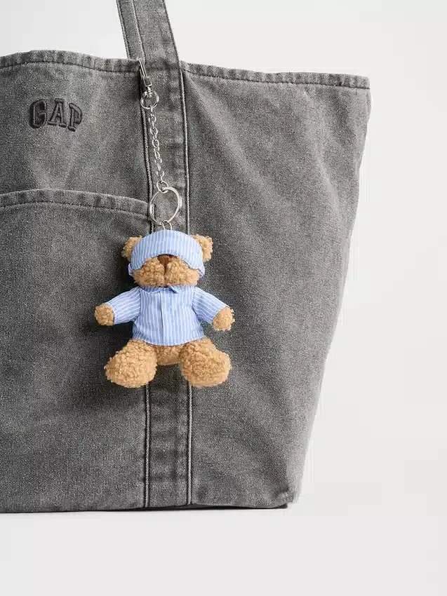 Ciondolo per borsa Brannan Bear a forma di sacco a pelo