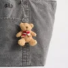 Ciondolo per borsa con sciarpa e orsetto Brannan