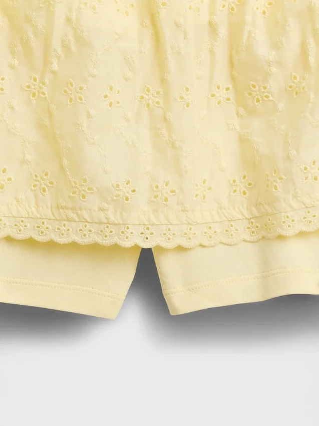 Gonnellina con orlo ripiegato e occhielli per bambini