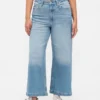 Jeans a gamba larga e caviglia, con vita alta e linea sinuosa