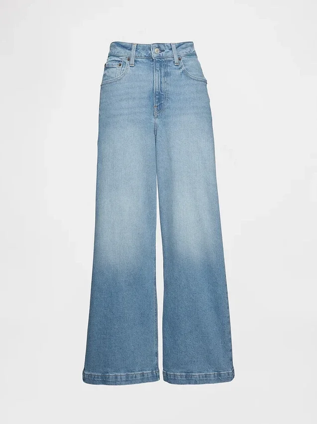 Jeans a gamba larga e caviglia, con vita alta e linea sinuosa
