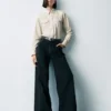 Jeans a vita alta con gamba larga