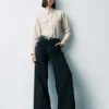 Jeans a vita alta con gamba larga