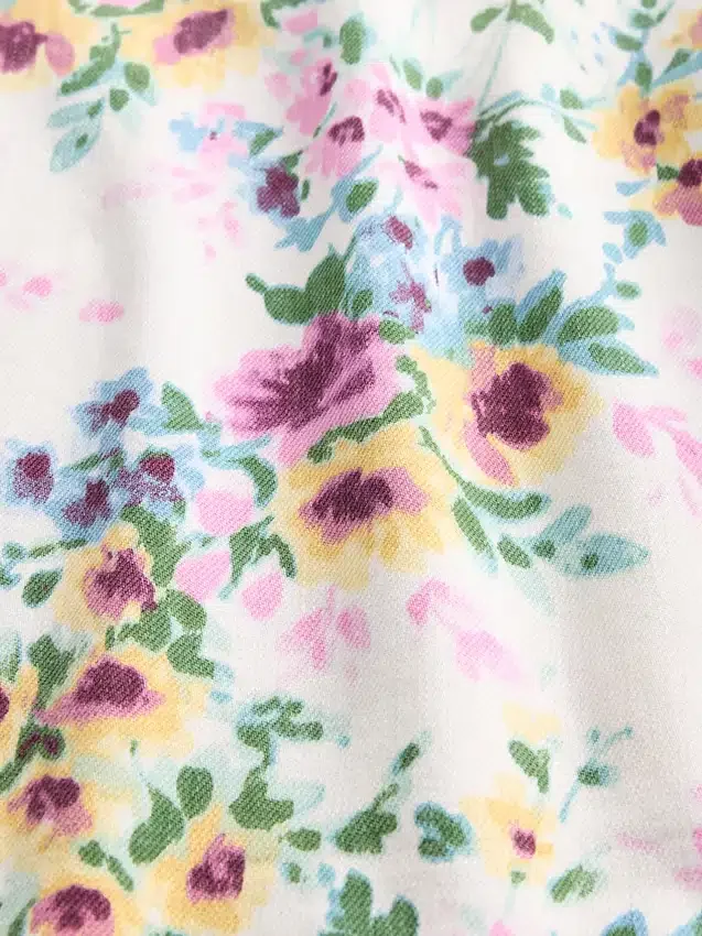 Jeans a vita alta con taglio a barilotto e motivo floreale