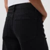 Jeans a vita alta, gamba larga e lunghezza alla caviglia