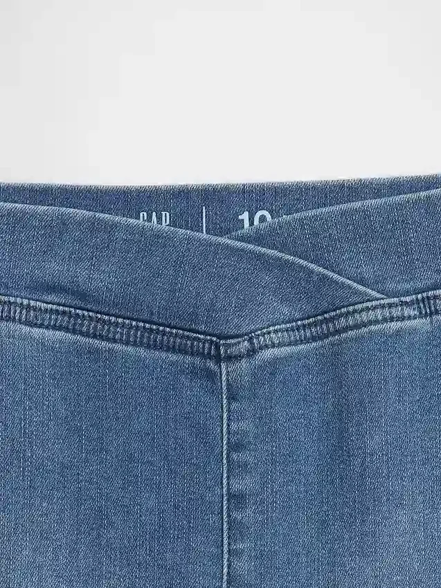 Jeans a vita alta svasati con cintura incrociata per bambini