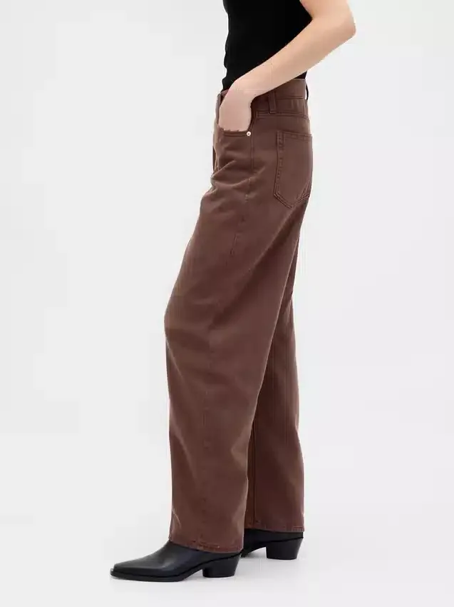 Jeans a vita alta, ultra morbidi, dal taglio "barrel" con incrocio