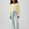 Jeans a vita bassa con chiusura allacciata e taglio svasato morbido per bambini