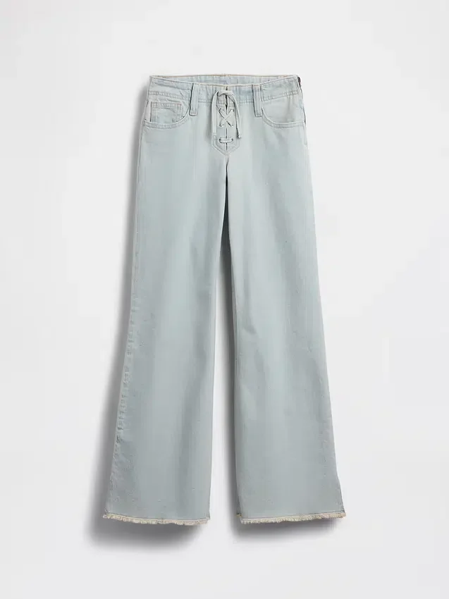 Jeans a vita bassa con chiusura allacciata e taglio svasato morbido per bambini