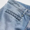 Jeans a vita bassa con tasche intrecciate, dal taglio lungo e slanciato