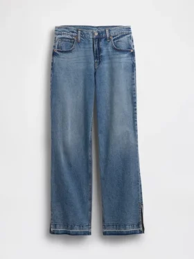 Jeans a vita bassa in stile anni '90, dal taglio ampio e con orlo a spacco