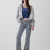 Jeans a vita bassa, lunghi e slim a righe