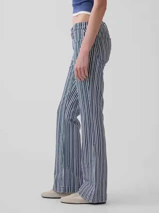 Jeans a vita bassa, lunghi e slim a righe