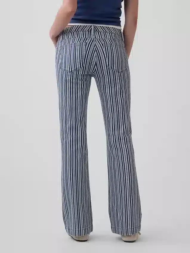 Jeans a vita bassa, lunghi e slim a righe