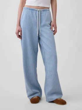 Jeans a vita bassa, morbidissimi, dal taglio ampio e a righe in stile anni ’90