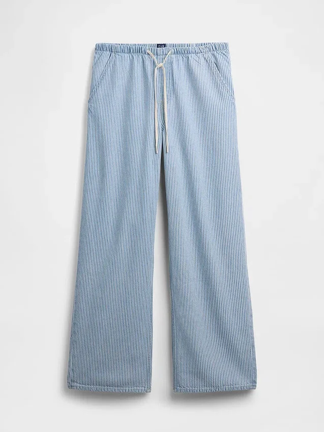 Jeans a vita bassa, morbidissimi, dal taglio ampio e a righe in stile anni ’90
