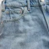 Jeans a vita media, rigidi, dal taglio rilassato e svasati