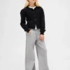 Jeans baggy a vita bassa con fiocco e orlo a spacco per bambini
