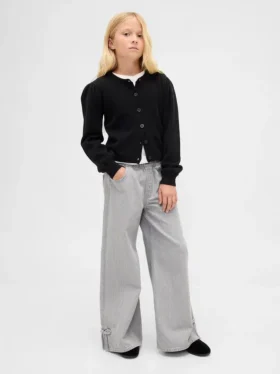 Jeans baggy a vita bassa con fiocco e orlo a spacco per bambini