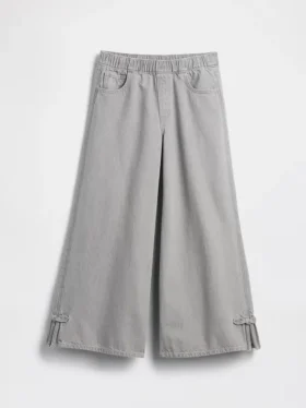 Jeans baggy a vita bassa con fiocco e orlo a spacco per bambini