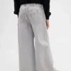 Jeans baggy a vita bassa con fiocco e orlo a spacco per bambini