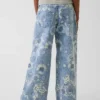 Jeans baggy a vita bassa con motivo floreale per bambini