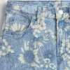 Jeans baggy a vita bassa con motivo floreale per bambini