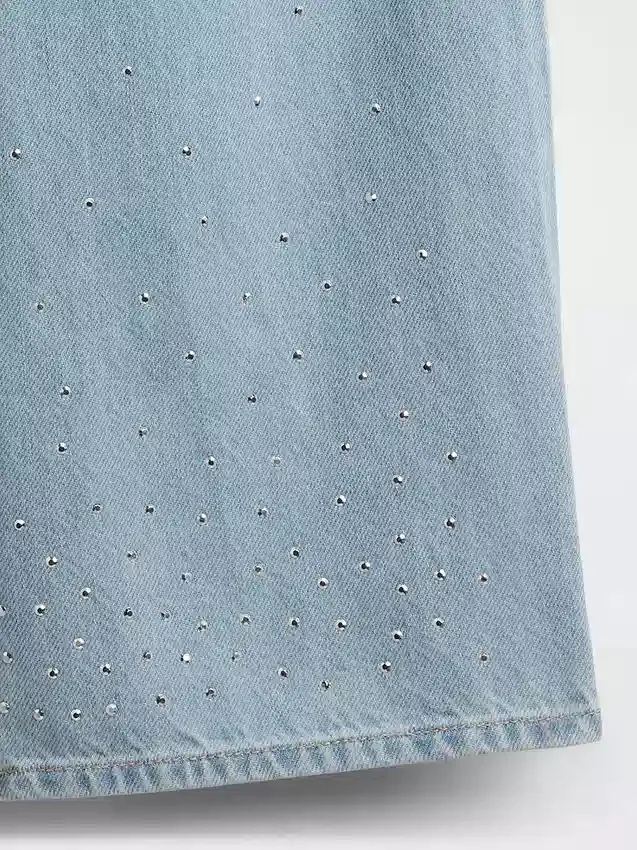 Jeans da bambino a vita bassa, gamba larga e strass