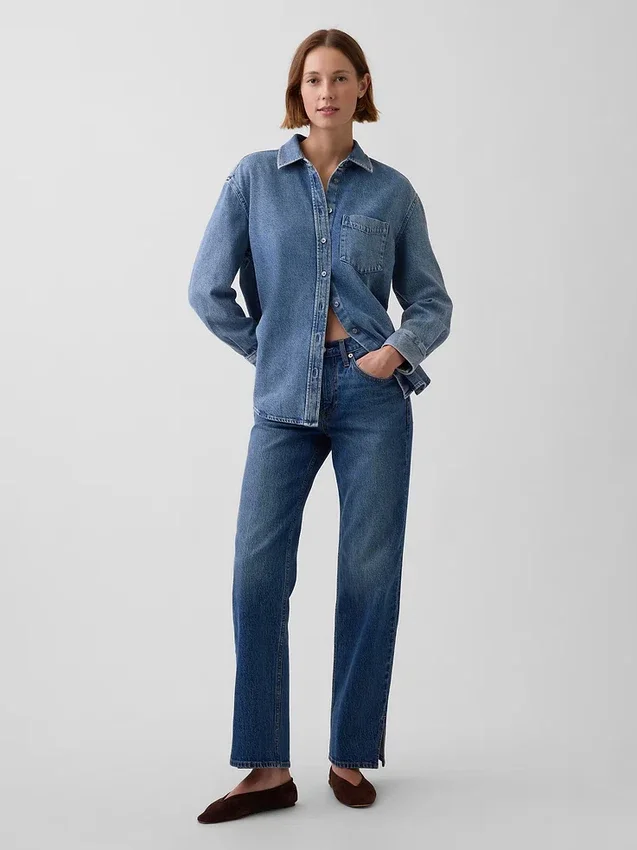 Jeans dritti dal taglio rilassato a vita media con orlo asimmetrico