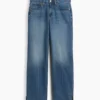 Jeans dritti dal taglio rilassato a vita media con orlo asimmetrico