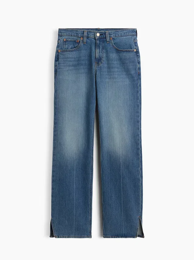 Jeans dritti dal taglio rilassato a vita media con orlo asimmetrico