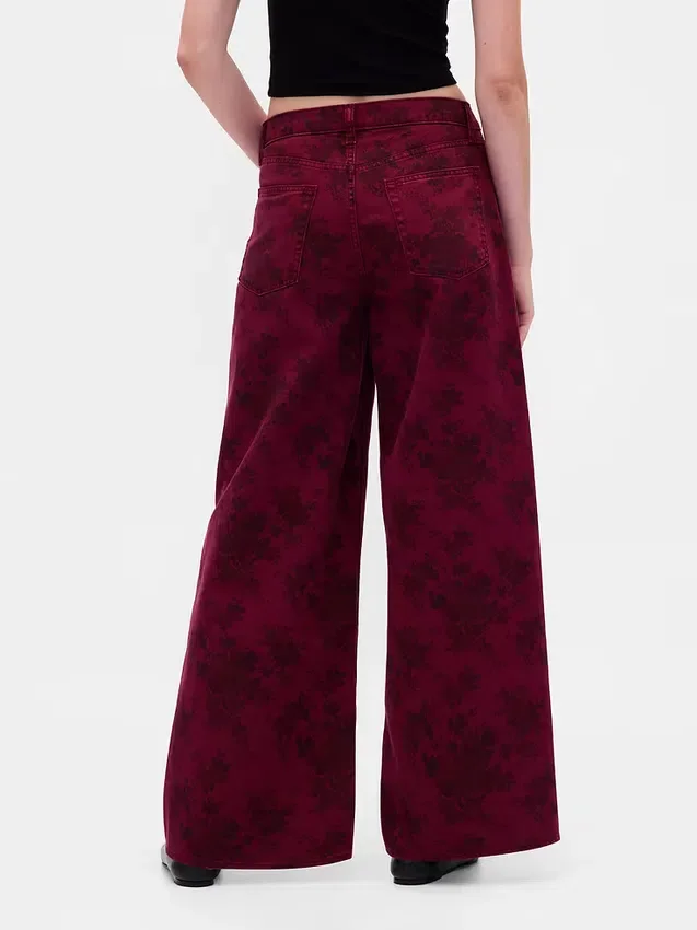 Jeans larghi a vita media con motivo floreale
