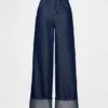Jeans larghi a vita media con risvolto metallizzato