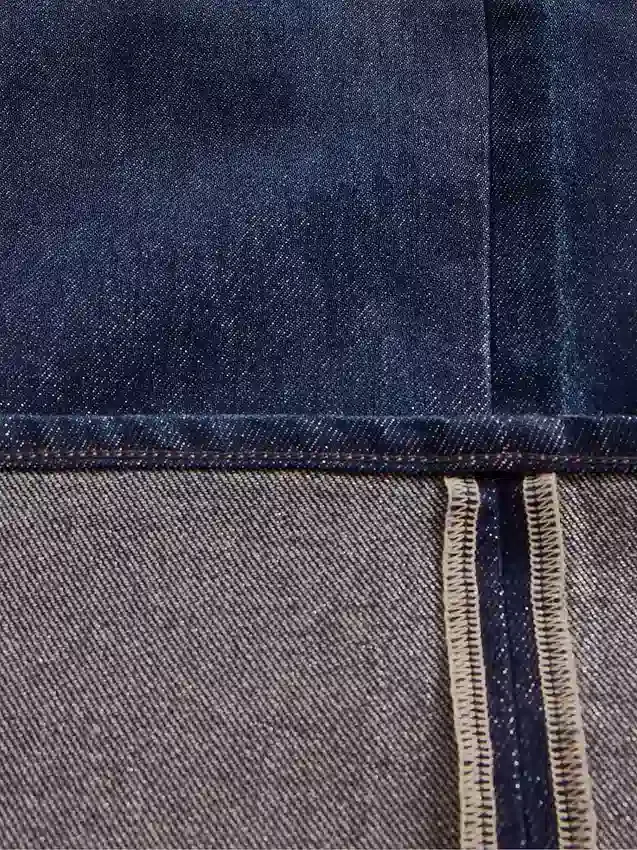 Jeans larghi a vita media con risvolto metallizzato