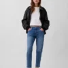Jeans slim a vita media con gamba affusolata