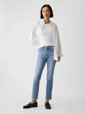 Jeans slim vintage a vita media con orlo a spacco