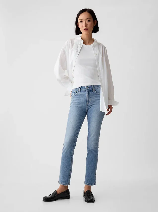 Jeans slim vintage a vita media con orlo a spacco