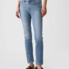 Jeans slim vintage a vita media con orlo a spacco