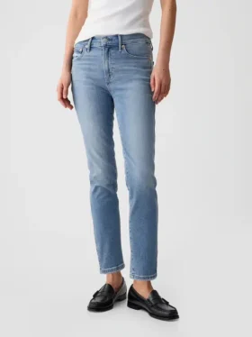Jeans slim vintage a vita media con orlo a spacco