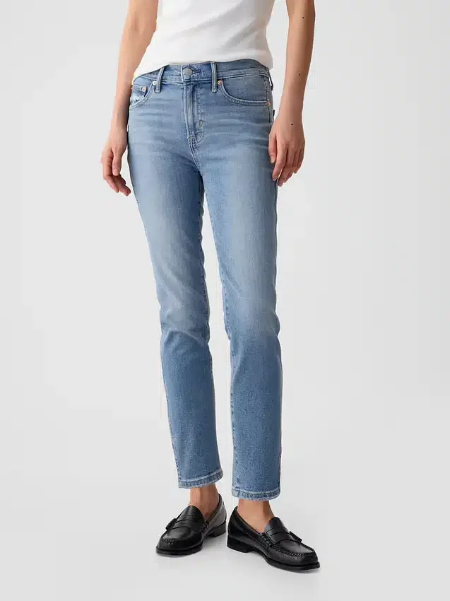 Jeans slim vintage a vita media con orlo a spacco