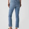 Jeans slim vintage a vita media con orlo a spacco