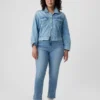 Jeans slim vintage a vita media con orlo a spacco