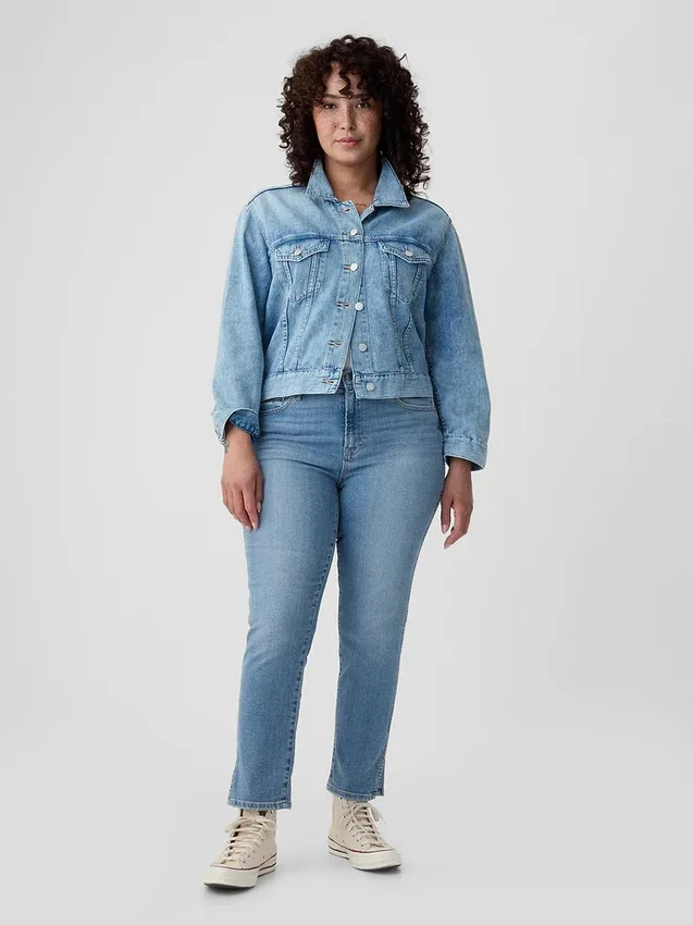 Jeans slim vintage a vita media con orlo a spacco
