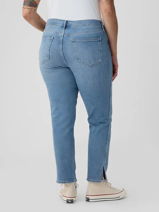 Jeans slim vintage a vita media con orlo a spacco